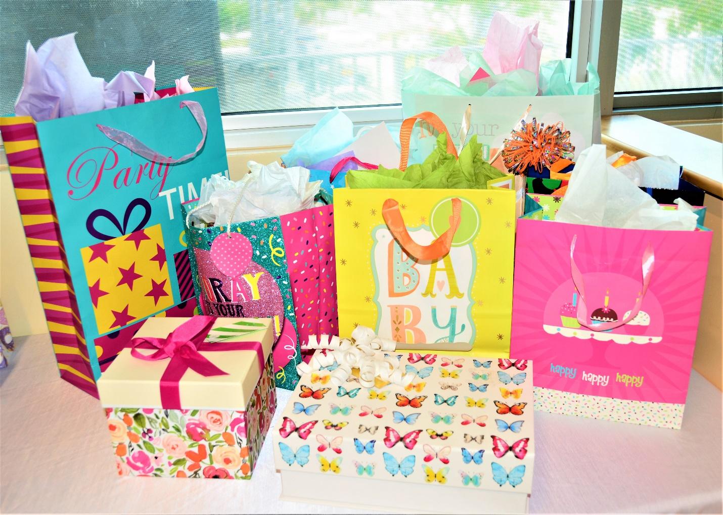 Assorted birthday bags and gifts on the table