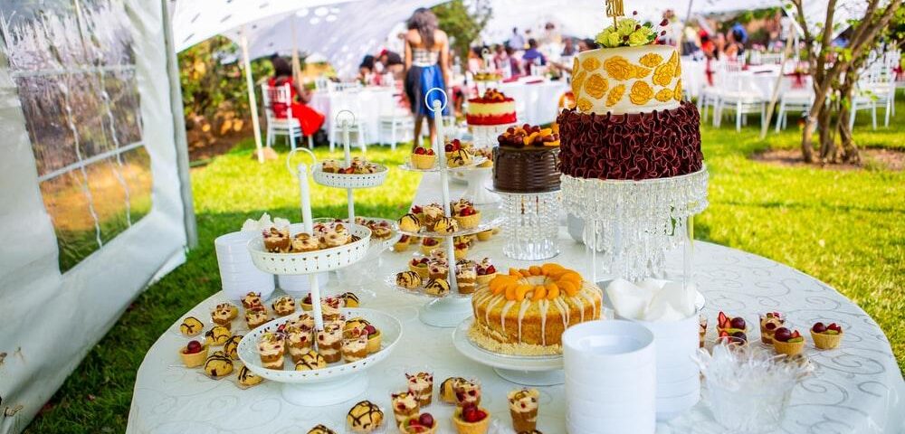 A decorated table filled with food on a birthday party