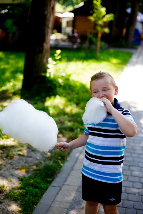 : Kid enjoying cotton candy
