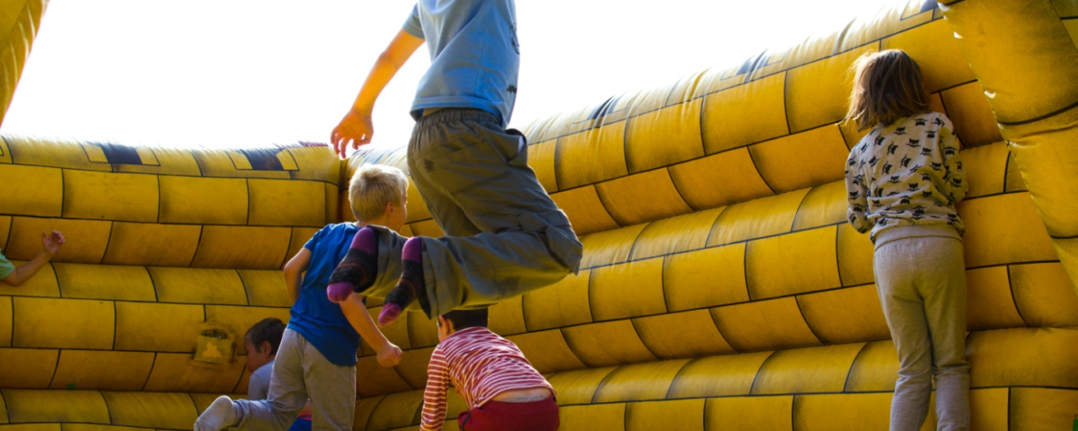 children having fun in an inflatable castle