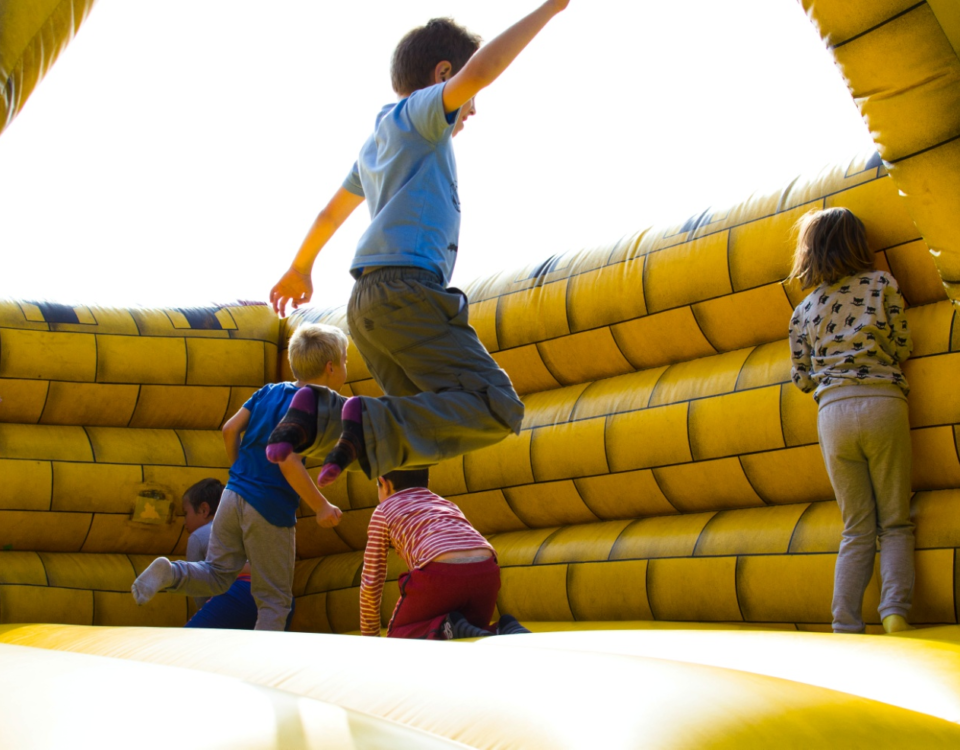 children having fun in an inflatable castle