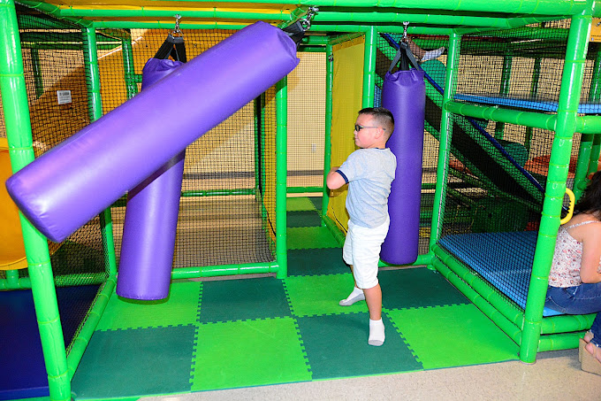 A boy playing in the indoor playground at BirthdayLand