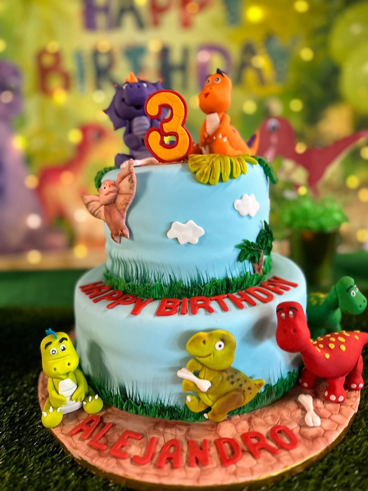 a dinosaur-themed party cake