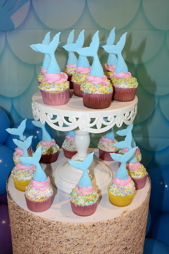 cupcakes being served for an underwater birthday-themed party