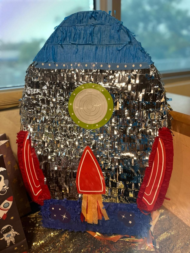 a rocket decoration piece at a space-themed birthday party 