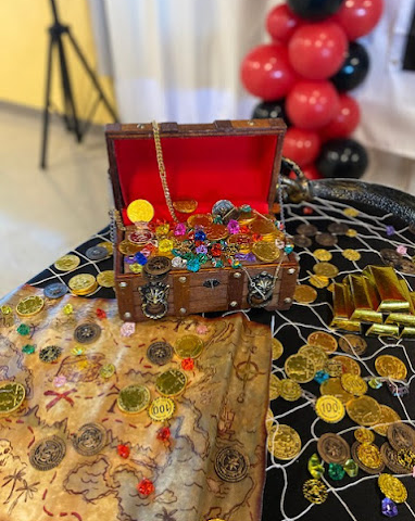 A box of treasure as part of scavenger hunt décor for kid’s party at BirthdayLand