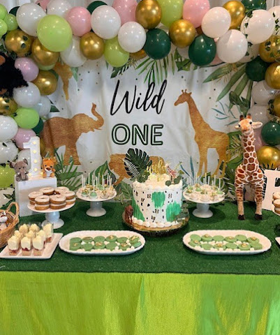 a table covered with party foods for a kid's party
