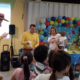 People entertaining kids in a themed birthday party