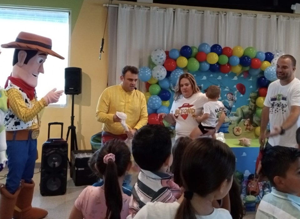 People entertaining kids in a themed birthday party