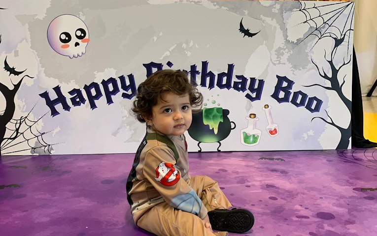 A toddler at a birthday party