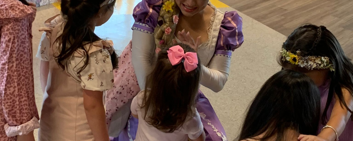 A dressed-up woman greeting with kids