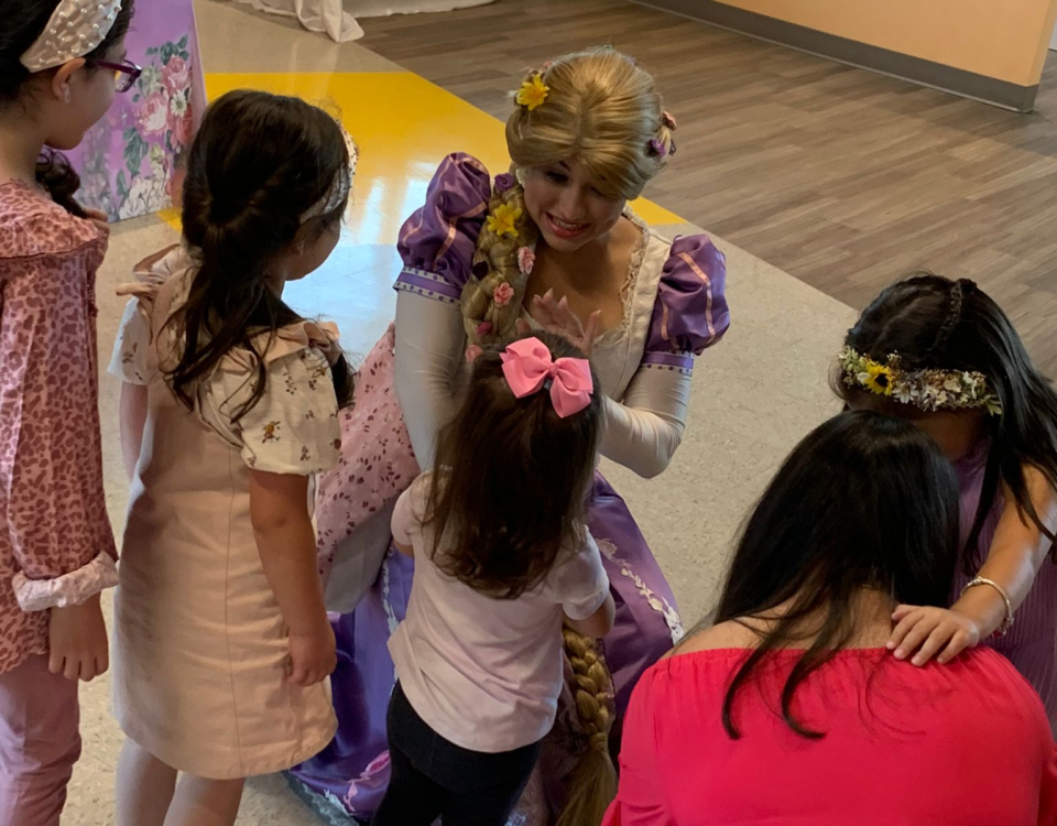 A dressed-up woman greeting with kids