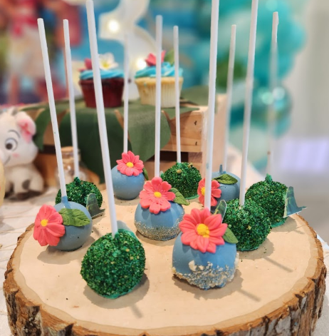 Colorful and festive cake pops arranged on a display table 