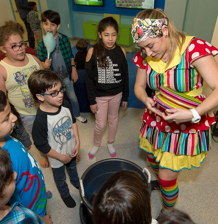 Kids enjoying creative pizza-themed games at a birthday party