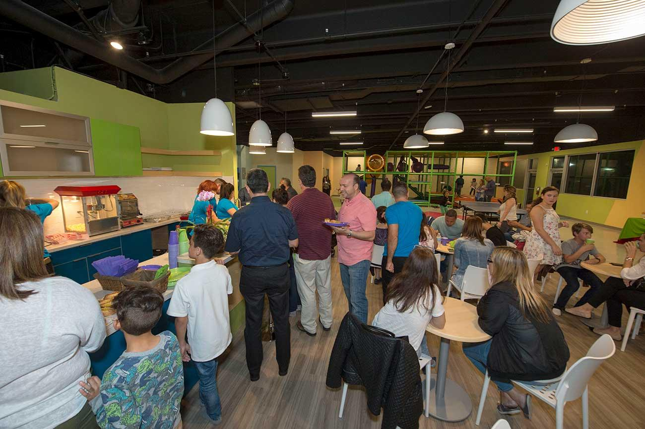 Adults and kids at a birthday celebration 