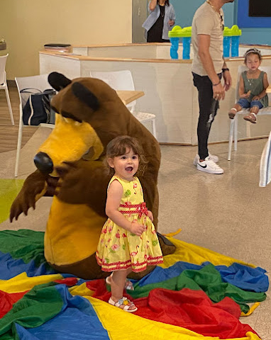 A kid with a stuffed bear