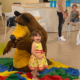 A kid with a stuffed bear
