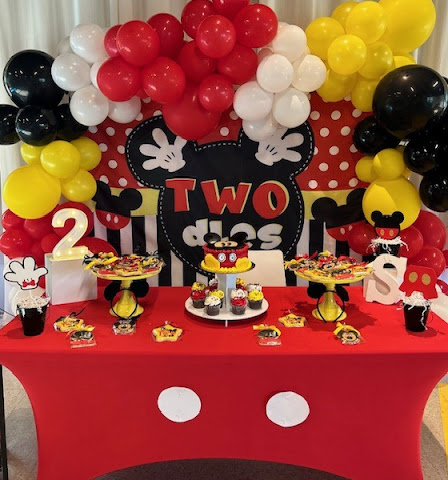 a Mickey Mouse themed birthday table