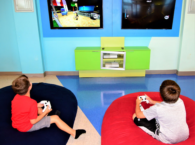 Two kids playing a video game