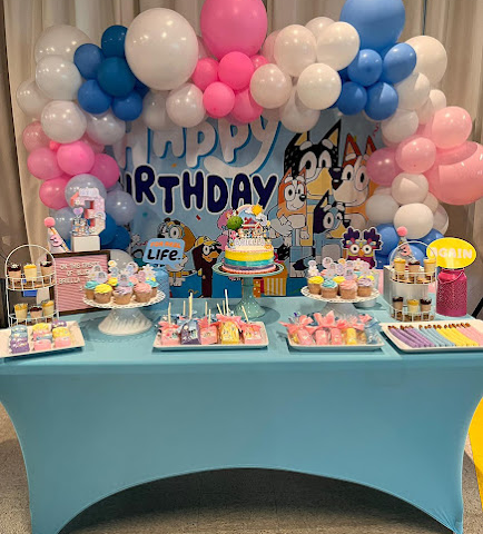 A birthday party décor table with cake and sweets at BirthdayLand