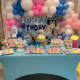 A birthday party décor table with cake and sweets at BirthdayLand